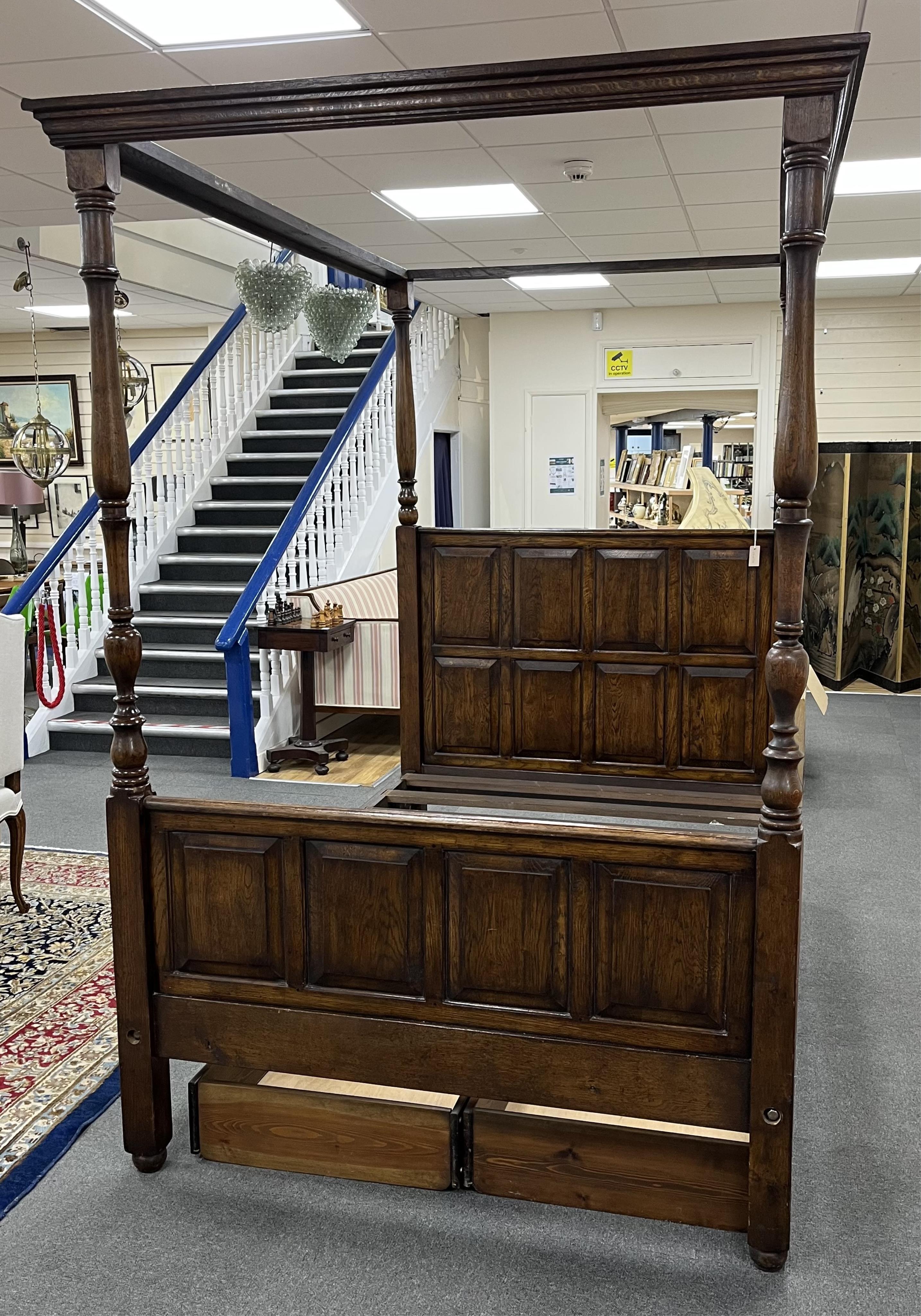 A reproduction 17th century style oak four poster bed frame, width 140cm, length 210cm, height 223cm. Condition - good